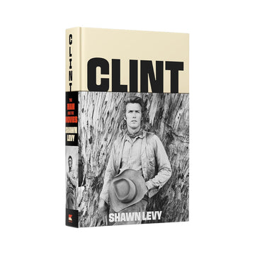 Book titled 'Clint' by Shawn Levy with a black and white photo of a person wearing a hat on the cover.